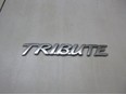 Эмблема на крышку багажника Tribute 2007-2011